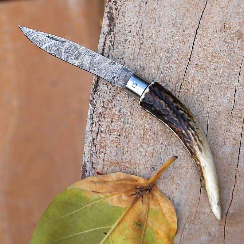 Handmade Damascus steel folding knife